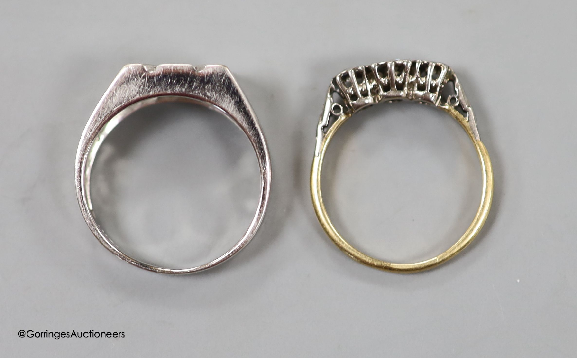 A diamond-set 14ct white gold ring, size R, gross 5.7 grams and an illusion-set three-stone diamond ring, 18ct gold shank, size P, gross 2.5 grams.
